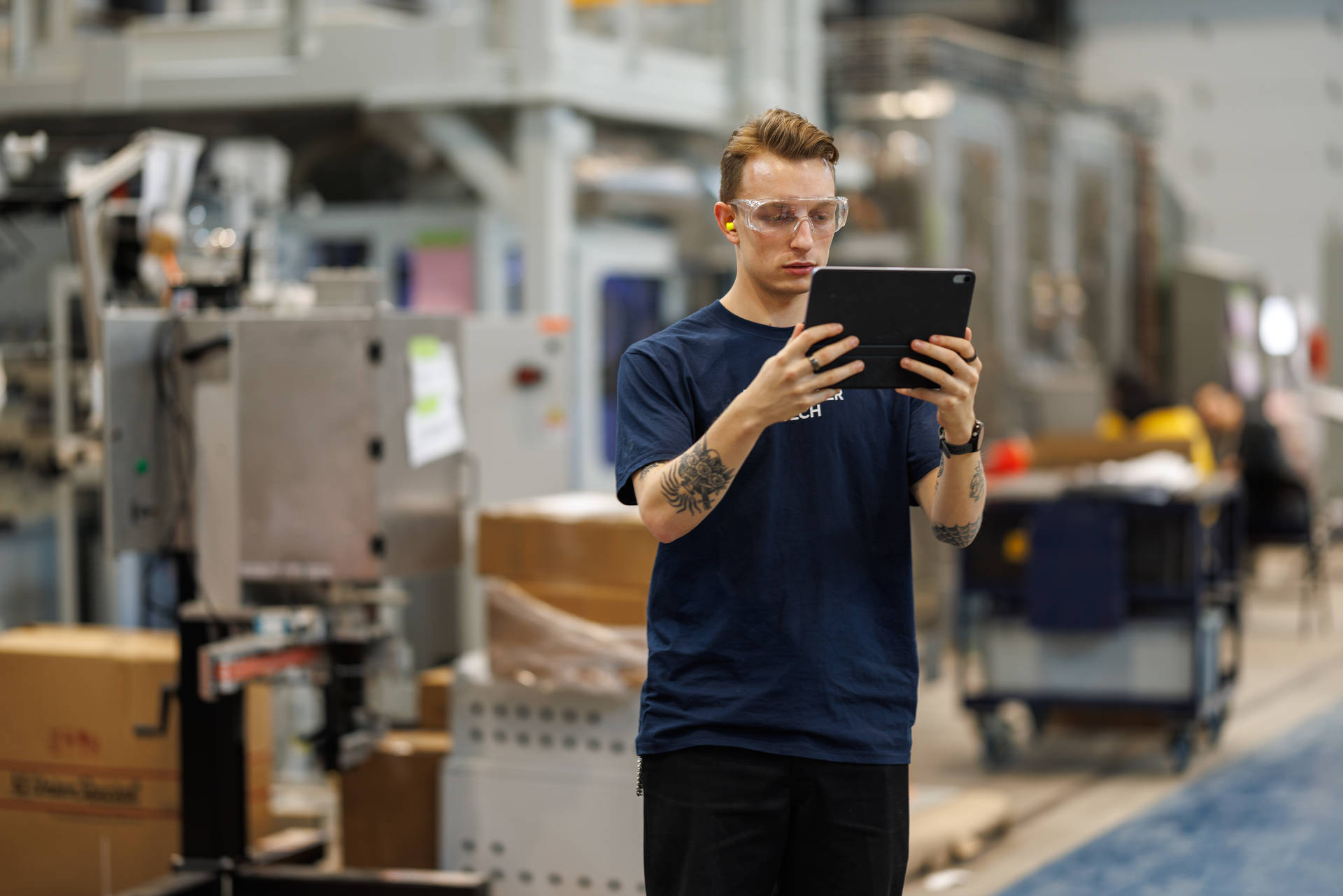 An aspiring operations engineer is seen getting used to a MES enabled device.